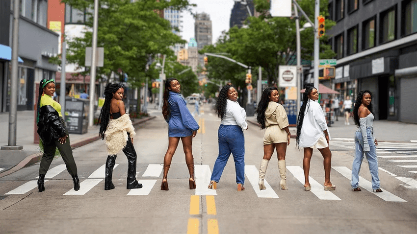 This shows former winners of TRESemme's Future Stylist scholarships posing in a crosswalk.